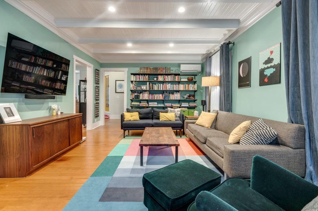 Newly remodeled living room with green accents