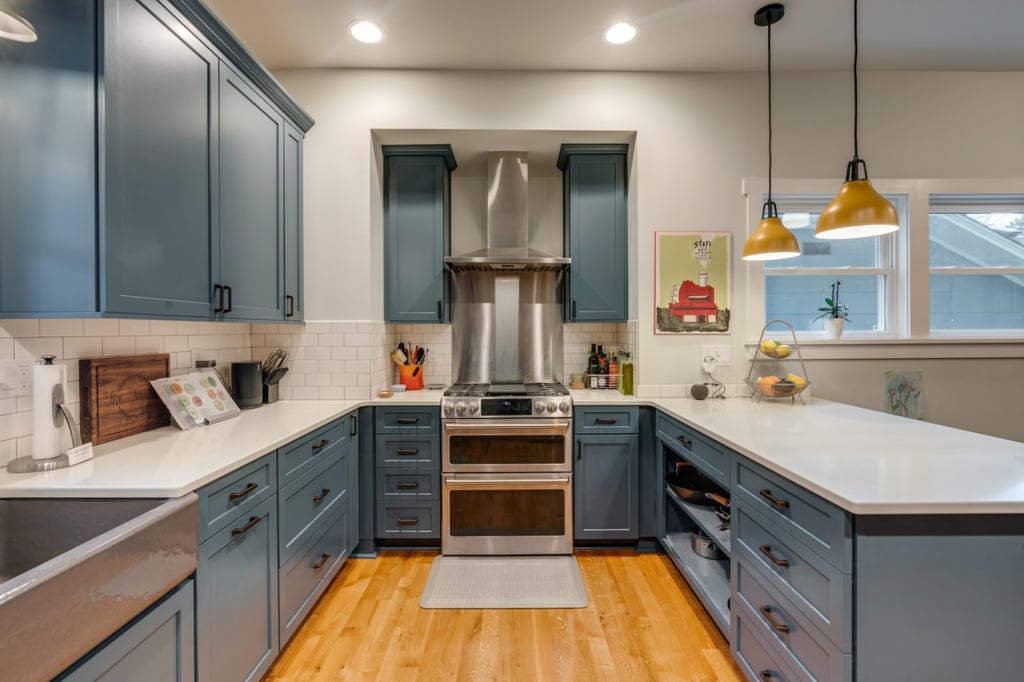 kitchen remodeling project with blue cabinets and white quartz countertops