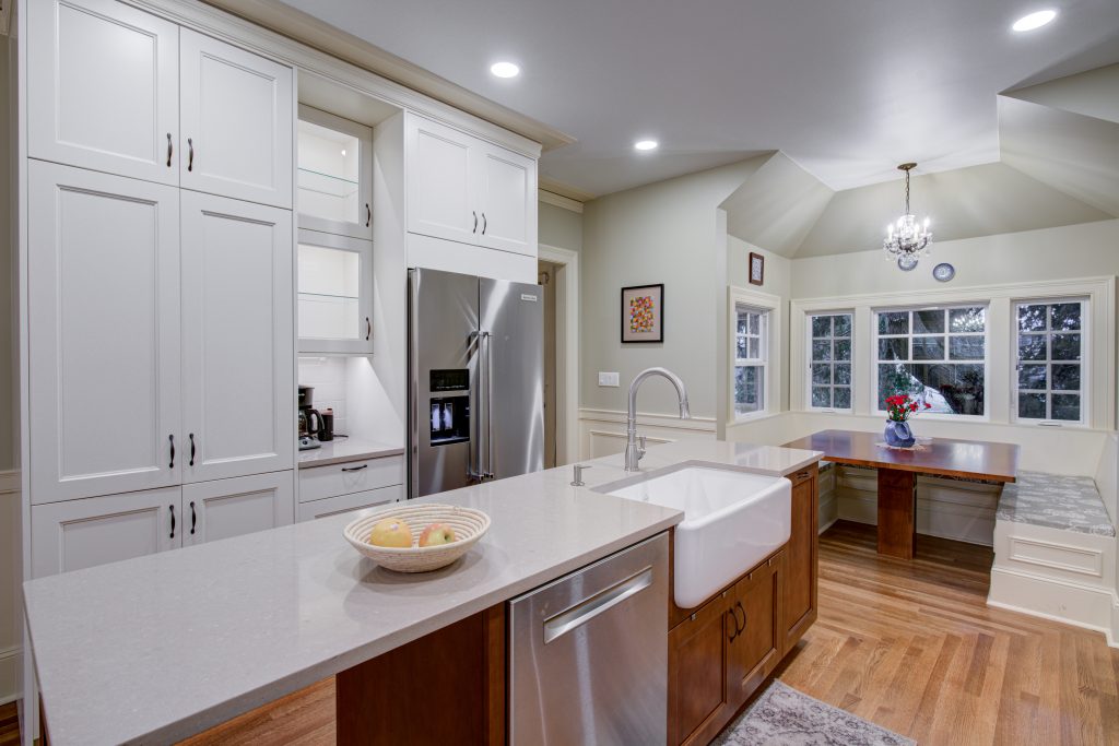 home remodel with new kitchen, kitchen island, farm sink, and banquette seating