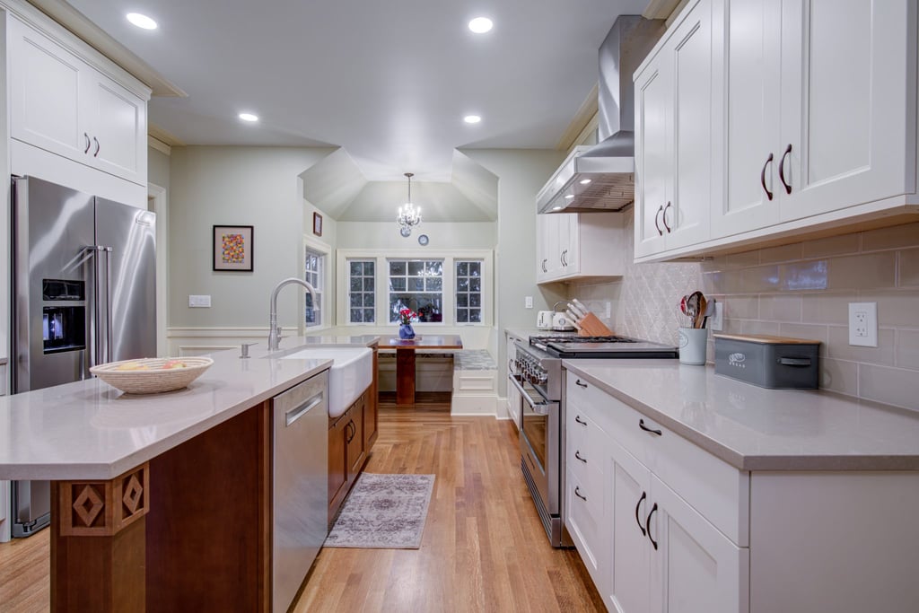 new kitchen remodel with sink on kitchen island and quartz countertops