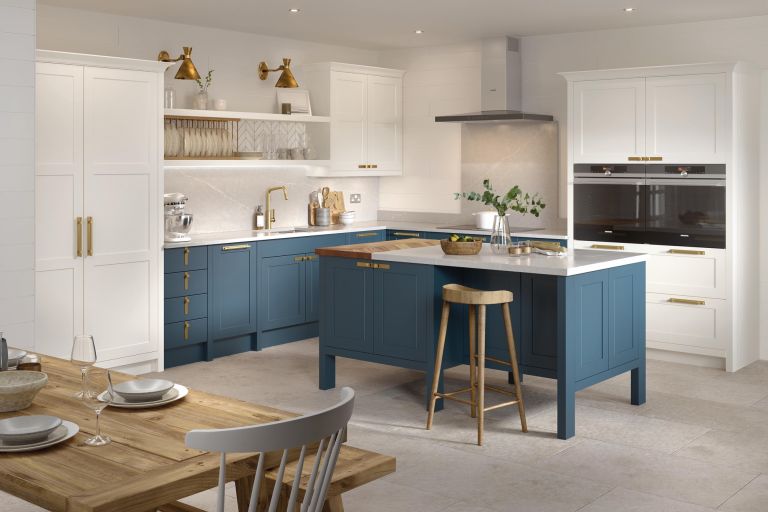 kitchen remodel with two tone cabinets, kitchen island, and double ovens in the cabinetry